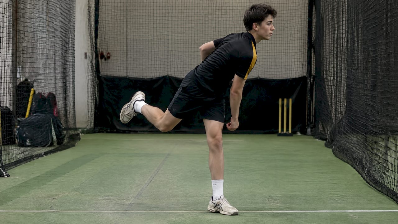 Bowler holding balanced front-foot landing